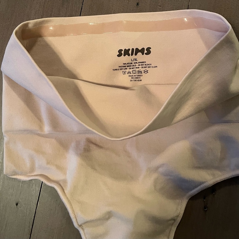 High-Waisted SKIMS Cream Thong Shapewear​ - Picture 3 of 3